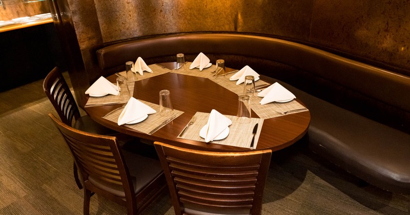 Interior, separated private table ready for guests