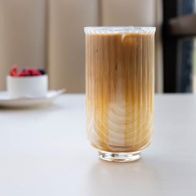 Iced latte served in a textured glass.