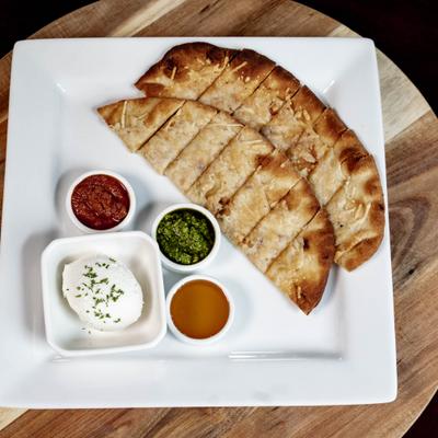 Served toasted bread with dips.