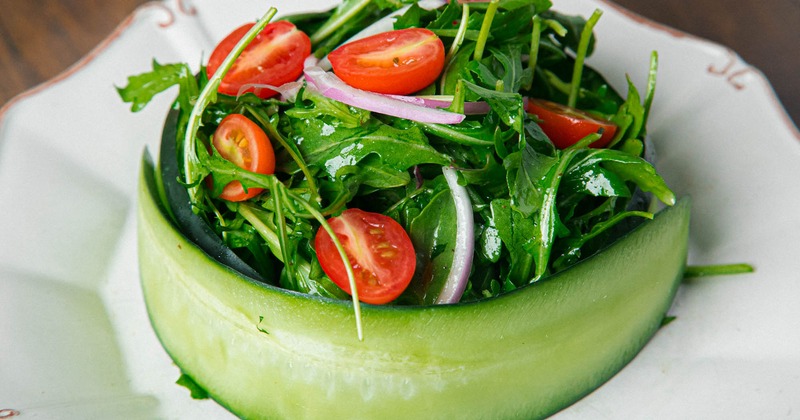 Sabrosa salad, with arugula, cucumber, red onions, tomato, and balsamic