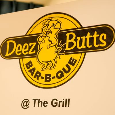 Restaurant's sign with a name and cartoon pig character.