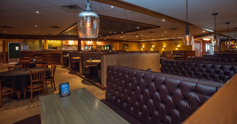 Interior, tables, chairs and brown, buttoned leather seating booths