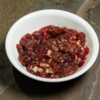 Raw marinated Beef Bulgogi served in a white bowl.