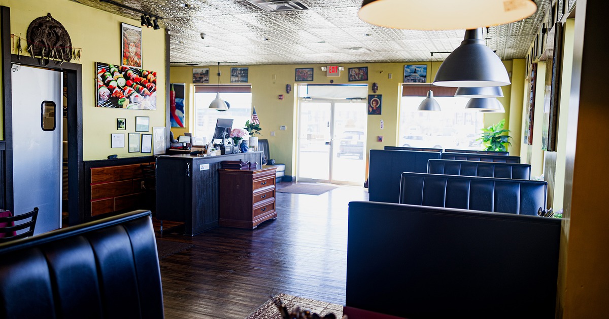 Interior space, dining booths, entrance door