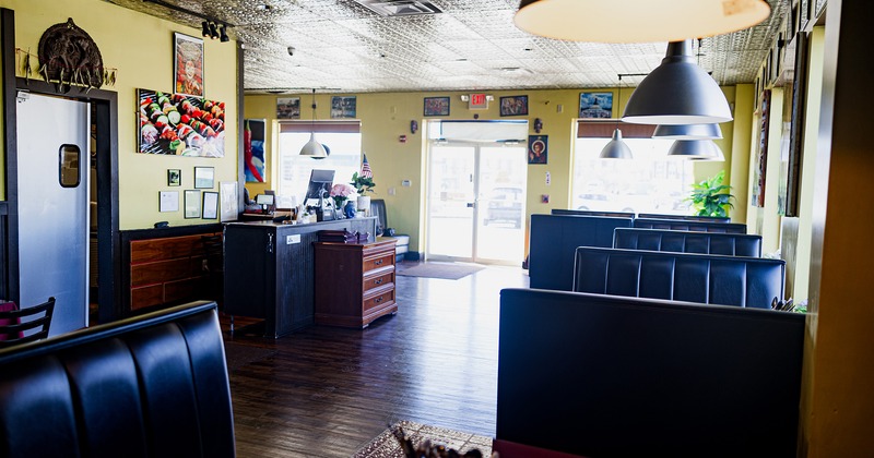 Interior space, dining booths, entrance door