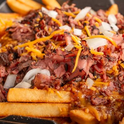 Pastrami chili cheese fries, close up shot.