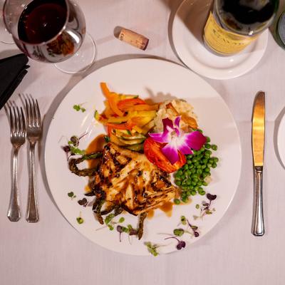 Chilean Sea Bass with mashed potatoes and cooked vegetables.