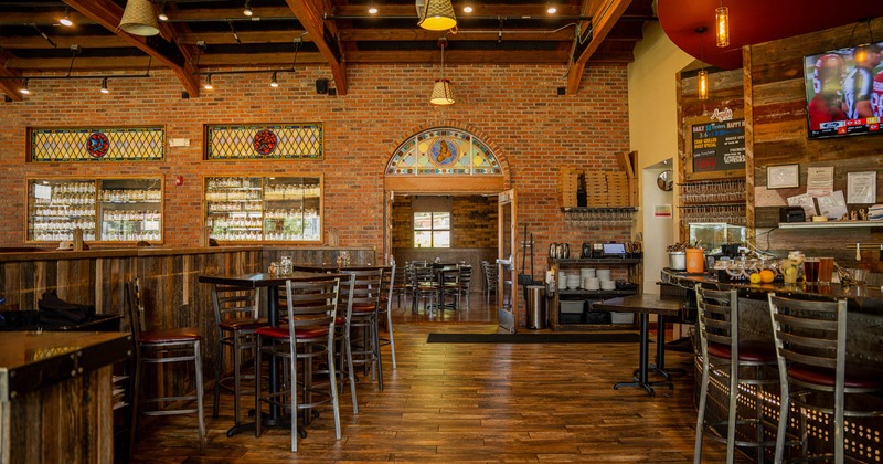 Interior with wooden accents, brick walls and stained glass windows