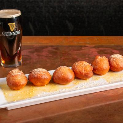 Romano Bread Puffs served with a beer.
