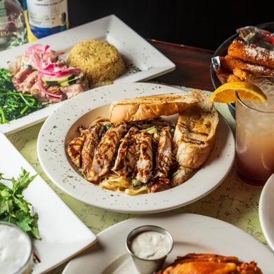 Assortment of dishes with chicken fettuccine as the centerpiece.