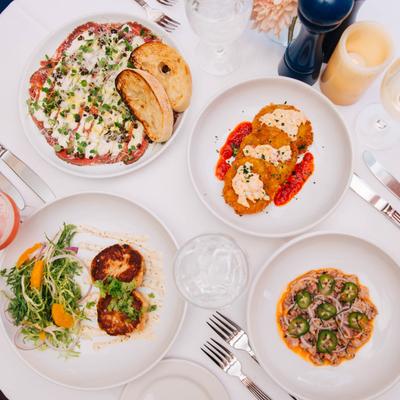 Various food and drinks on the table.