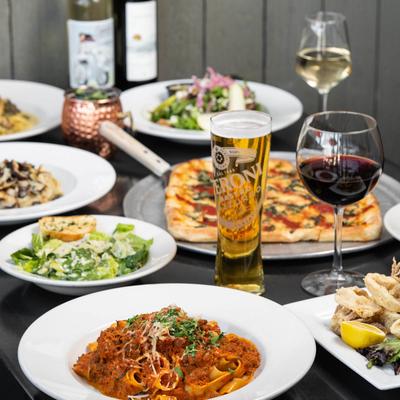 Assortment of food dishes and drinks displayed on a table.
