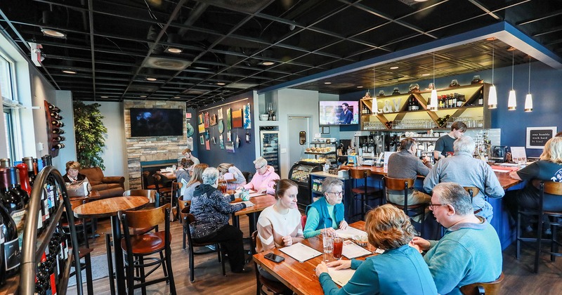 Interior full of seated guests
