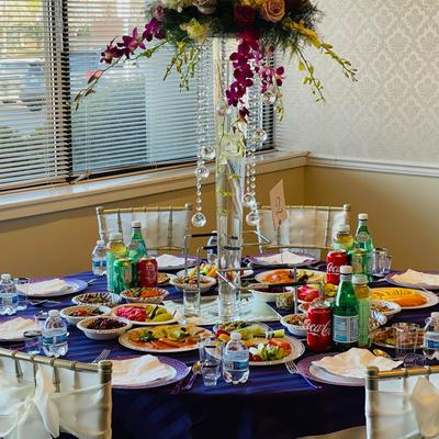 Interior, a party table with tableware, served food plates and drinks