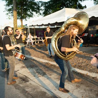 Brass band playing live outside of the restaurant.