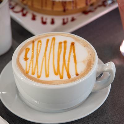Cappuccino with caramel drizzle.