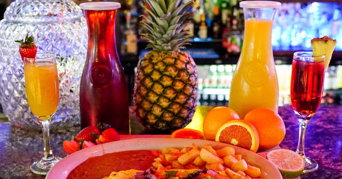 Breakfast Omelette with sides, served alongside fresh fruit and juices