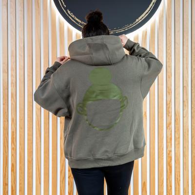 Woman in an olive green ''Hula Pot'' hoodie with logo, back view, closeup.