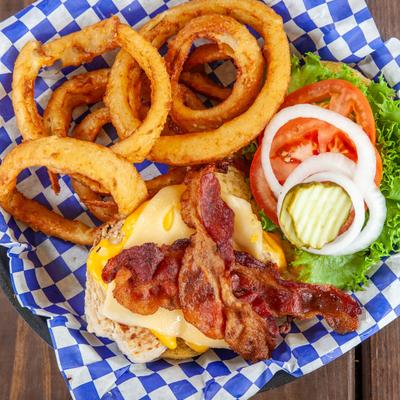 Grilled chicken sandwich, with bacon, cheese, and onion rings.