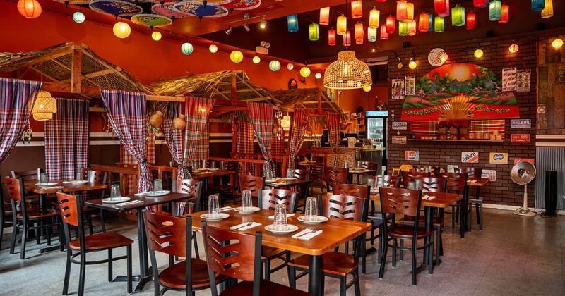 Warm and cozy interior dining area with set tables ready for guests