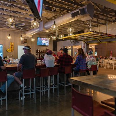 Customers sitting at the bar.