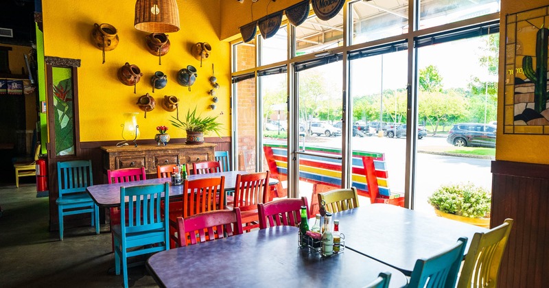 Interior, seating area, tables with colorful chairs