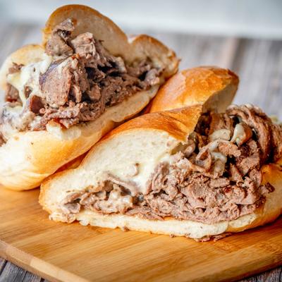 Shredded steak and cheese on our figure 8 sub roll.