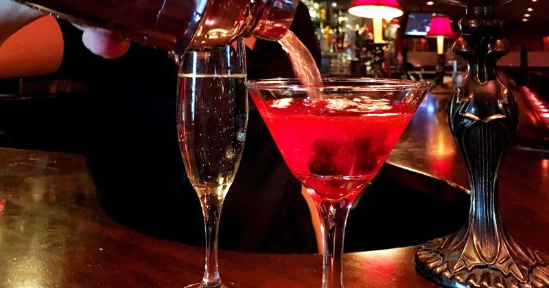 Pouring cocktail in the glass