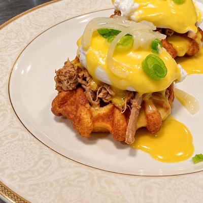 Lechon benedict: poached eggs, buttermilk waffle, salsa criolla.