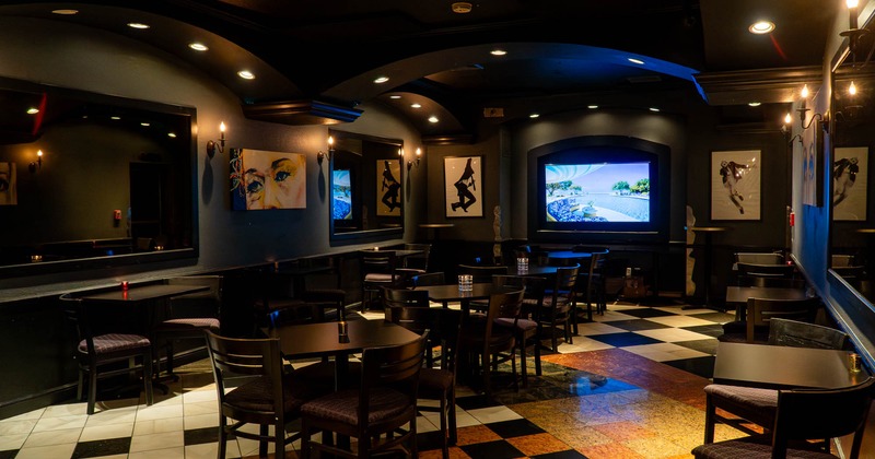 Restaurant interior with checkered floor and modern artwork