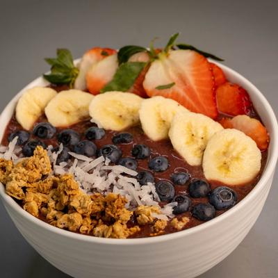 Acai Bowl, with granola, coconut shavings, berries, and banana.