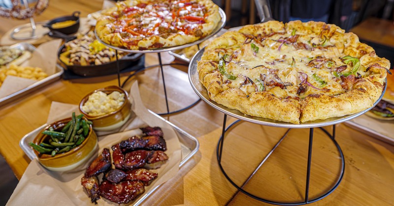 Pizzas and assorted dishes on a table