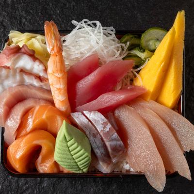 Chirashi bowl with a variety of sashimi such as salmon, tuna, shrimp, and octopus.