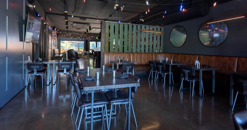 Interior, tables set for guests in dining area