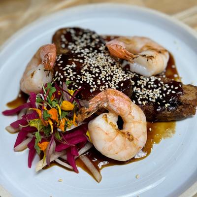 Surf & turf, Kurobuta pork, marinated prawns, toasted sesame seeds, sweet soy glaze, pickled daichon.