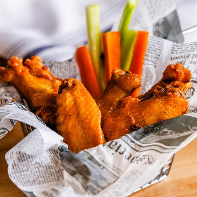 Chicken wings with carrots and celery.
