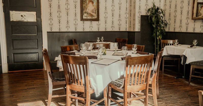 Interior, set tables and chairs ready for guests