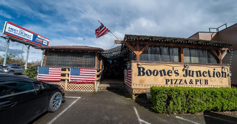 Exterior, front view, entrance to restaurant, parking lot