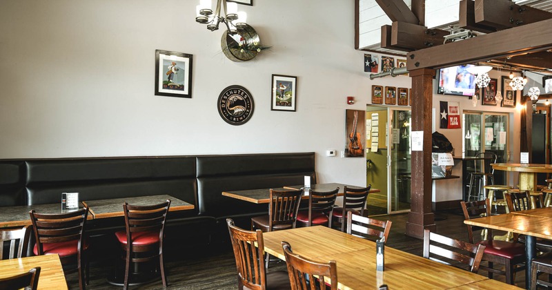 Interior, tables, chairs and high back leather benches