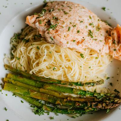 Salmon served with pasta and asparagus