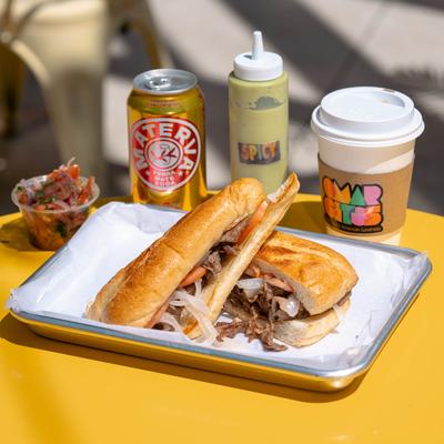 Steak sandwich and drinks.