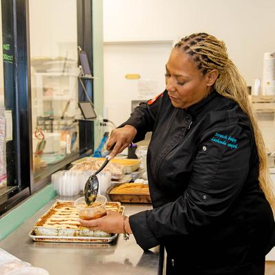 A staff member working in the kitchen.