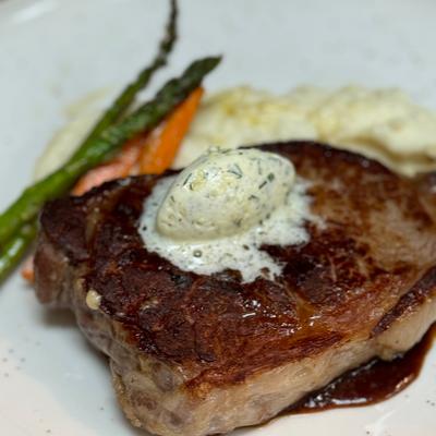 Brandt Beef Ribeye, mashed potatoes, fried Brussels sprouts, compound butter.