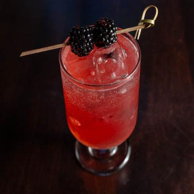 Blueberry vodka, pama liqueur, simple syrup, lime juice, sugar rim.
