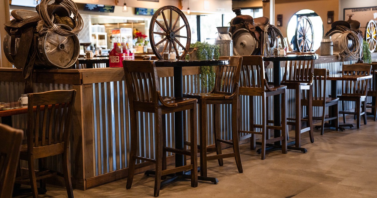 Tall tables and bar stools for two people