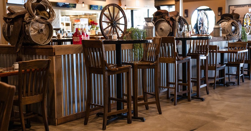 Tall tables and bar stools for two people