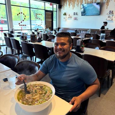 Guest eating a large bowl of soup.