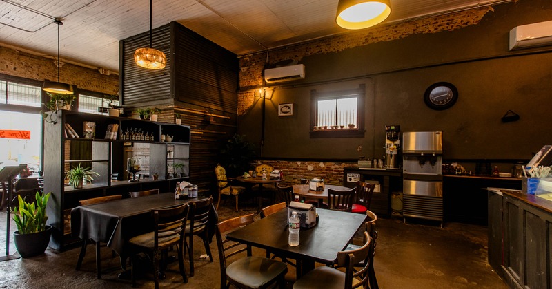 Interior of a rustic café with wooden furniture and a warm atmosphere.