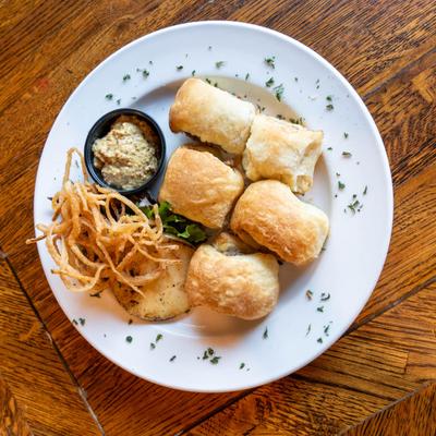 Sausage Rolls, onion straws, grilled apple, and spicy multi-grain mustard.