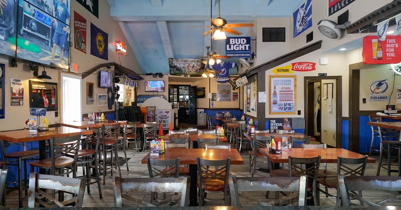 Interior, tables and chairs, ceiling fans with lanterns, various decoration, large TV